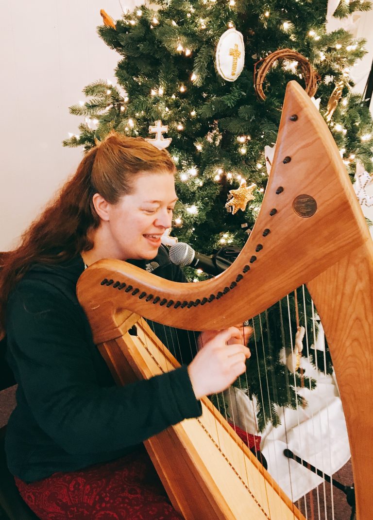 Holly and her harp at Christmastime